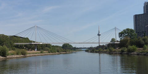 Fototapeta na wymiar Mannheim / Germany – Sept. 13, 2020: cityscape with bridge at the „Rhine-Neckar harbor“, one of the biggest european inner harbors, known for sustainability and environment protection.