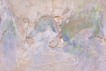 pink texture of old plaster on the street of the house