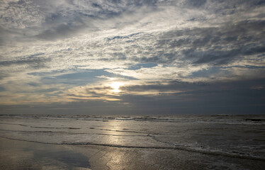 Fototapeta na wymiar Sunset at beach. North sea coast. Julianadorp. Netherlands.