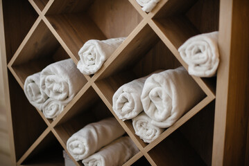 Fototapeta na wymiar Wardrobe with clean towels in the Spa beauty salon.