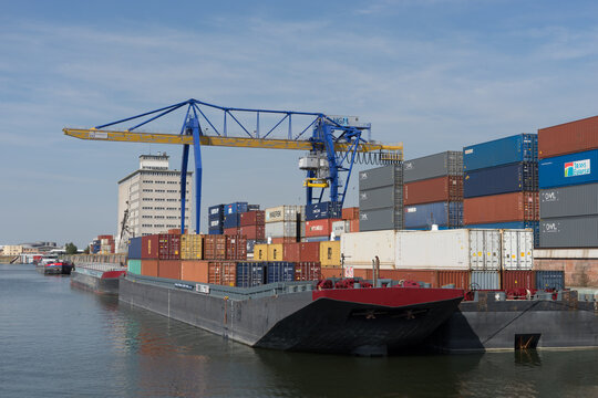 Mannheim / Germany – Sept. 13, 2020: the container yard with cranes of the „Rhine-Neckar harbor“, one of the biggest european inner harbors, known for sustainability and environment protection.
