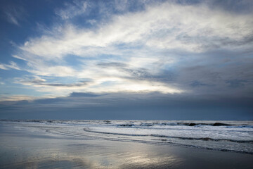 Fototapeta na wymiar Sea, waves and beach. North sea coast. Julianadorp. Netherlands.