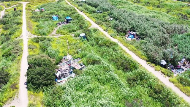 Aerial of tents and homeless encampments in the river bed area of Ventura, Oxnard, California.