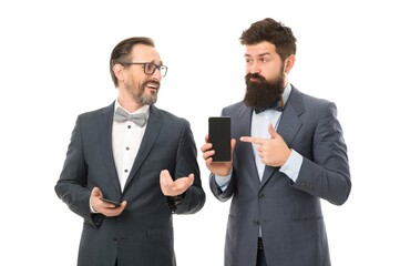 device shop assistant. bearded businessmen in formal suit. partnership of men speaking on phone. mature men. Agile business. collaboration teamwork. business communication on meeting. team success