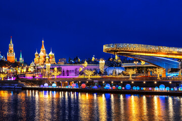 Fototapeta na wymiar View on Christmas Moscow, Kremlin and St. Basil's Cathedral on the Moscow river embankment. Russia