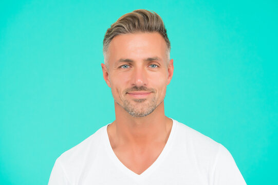 handsome unshaven man. good looking guy with bristle on face. facial hair care. male grooming fashion. barbershop beauty salon. mature smiling guy. casual style blue eyed man