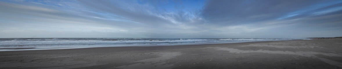 Sea, waves and beach. North sea coast. Julianadorp. Netherlands. Panorama.