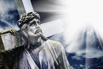 Crucifixion of Jesus Christ. Ancient stone statue. - obrazy, fototapety, plakaty