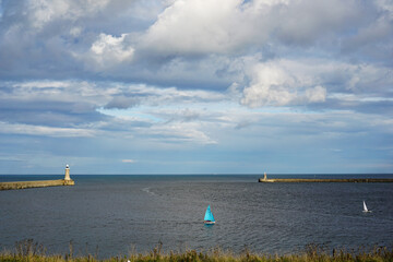 Sail boats in the mouth of the Tyne - Tynemouth on a summer day