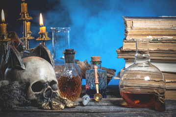 Magic potions on the alchemist table background.