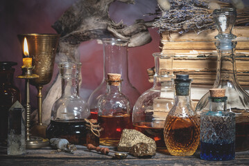 Magic potions on the alchemist table background.