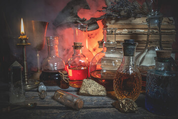 Magic potions on the alchemist table background.