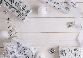Christmas Decorations and a Gift Box. Christmas White background. Flat lay.