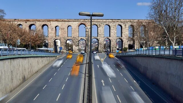 Time lapse clip near Valens Aqueduct (Bozdogan Su Kemeri) on sunny winter day with traffic of cars, Istanbul, Turkey