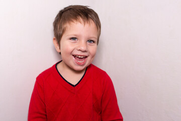 Happy beautiful baby on a white background