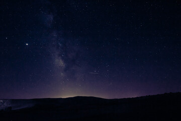 Fototapeta na wymiar Milkyway and silhouette of the hills