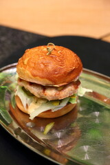 Grilled burger with meat patty, tomato and cheese
