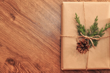 gifts in craft paper on wooden background