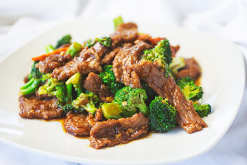 A view of a plate of beef broccoli.