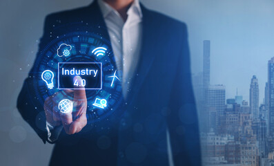 Obraz premium Industry 4.0. Businessman touching hologram with icons. Industrial technology concept. 