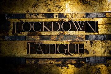 Lockdown Fatigue text message on textured grunge copper and vintage gold background