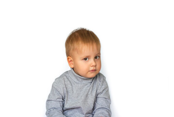 Portrait of a cute little boy. The child is isolated on a white background. Success, bright idea, creative ideas and innovative technological concepts.