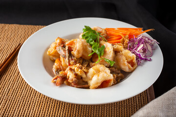 A view of a plate of honey walnut shrimp.