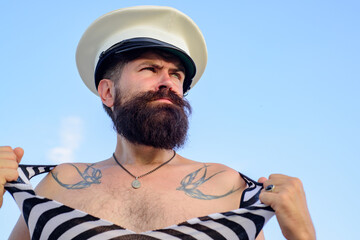 Portrait of serious funny captain. Bearded sailor, seaman or pirate.