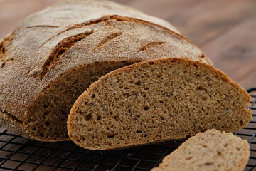 Freshly baked homemade artisan sourdough rye and white flour bread. Sliced. Copy space.