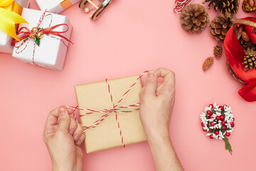Merry Christmas gift wrapping step by step, decorations on pink background, copy space