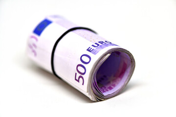 Roll of 500 euro money banknotes in rubber band