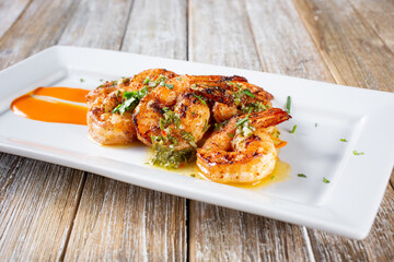 A view of a plate of grilled shrimp.