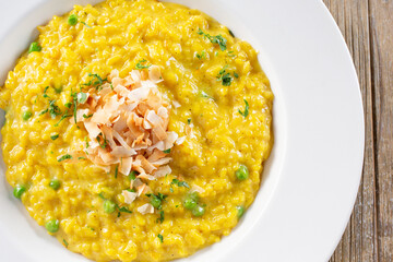 A top down view of a plate of saffron risotto.