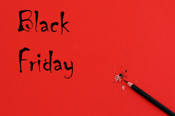 Minimal concept of Black  Friday red background with black pencil and advertising.
