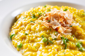 A view of a plate of saffron risotto.