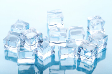 Obraz premium Ice cubes on blue background