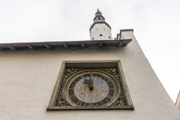 Tallinn, Estonia. The painted clock on the facade of the Church of the Holy Spirit (Puha Vaimu kirik)