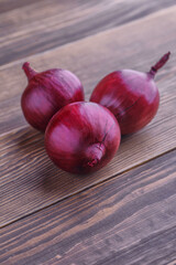 red onions on rustic wood