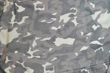 Camouflage background texture as backdrop for paintball and airsoft strikeball design projects