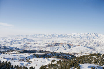 Location of the Tian Shan mountains, Uzbekistan, Central Asia. Incredible beauty of the winter landscape. The view from the cable car to the Ski resort Beldersay