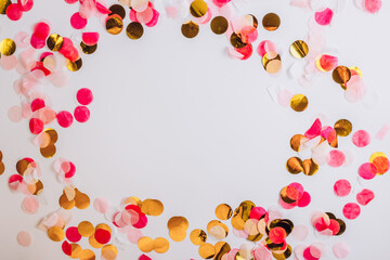 Colorful confetti on white background with copy space