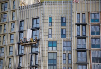 Fototapeta premium high-rise builders tall windows