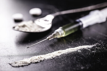 cocaine and heroin on dark wooden table, concept of addiction and chemical dependency, illegal drugs - obrazy, fototapety, plakaty
