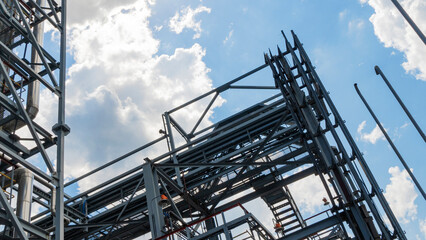 Petrochemical refinery plant. Industrial towers at oil refinery. Oil refinery twilight on classic blue sky background.. Space for text. Design concept.