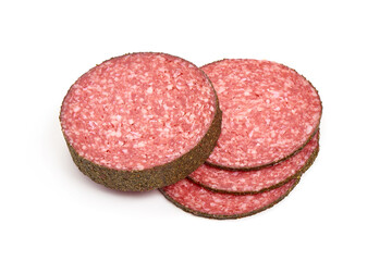 Peppered salami slices, isolated on white background