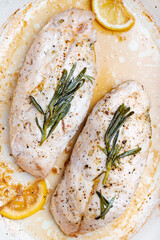Chicken breast fillet baked with lemon and rosemary