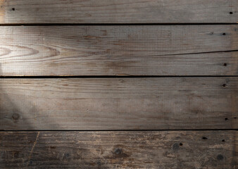 Old wooden surface with a ray of light