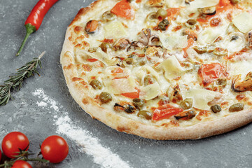 Seafood pizza. pizza with mozzarella, shrimp, octopus, squid, mussels and other seafood.