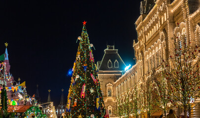 Fototapeta na wymiar December 20, 2019. Moscow, Russia. Decorated Christmas tree on red square in front of the Gum building in Moscow at night.