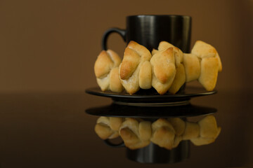 Cup coffee and cooking on a table with reflection